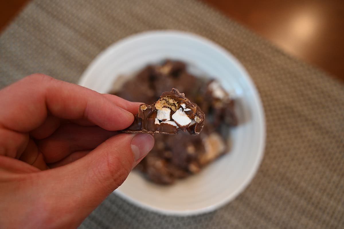Image of a caramel s'mores Snapper with a bite taken out of it so you can see marshmallows inside.