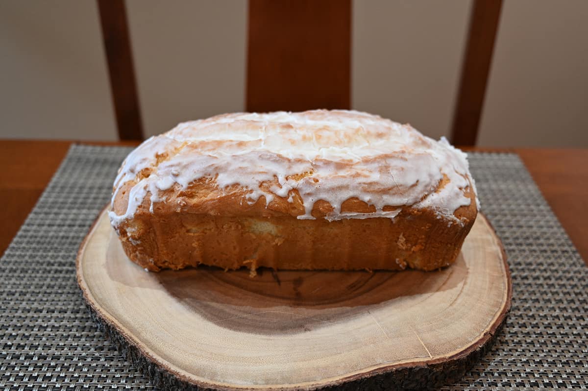 Top down image of the pound cake out of the packaging and served on a wooden cutting board.