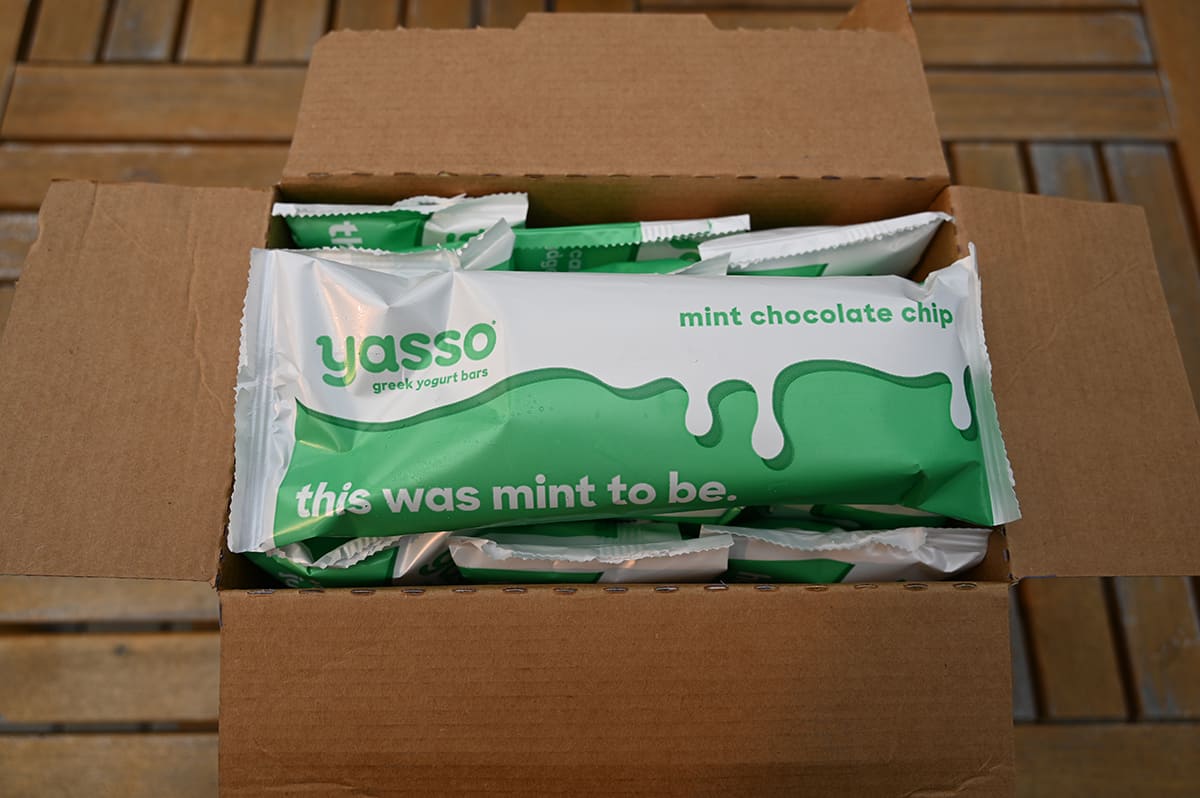 Image of an open box of Yasso bars showing the mint chocolate chip bars in individual wrappers in the box.