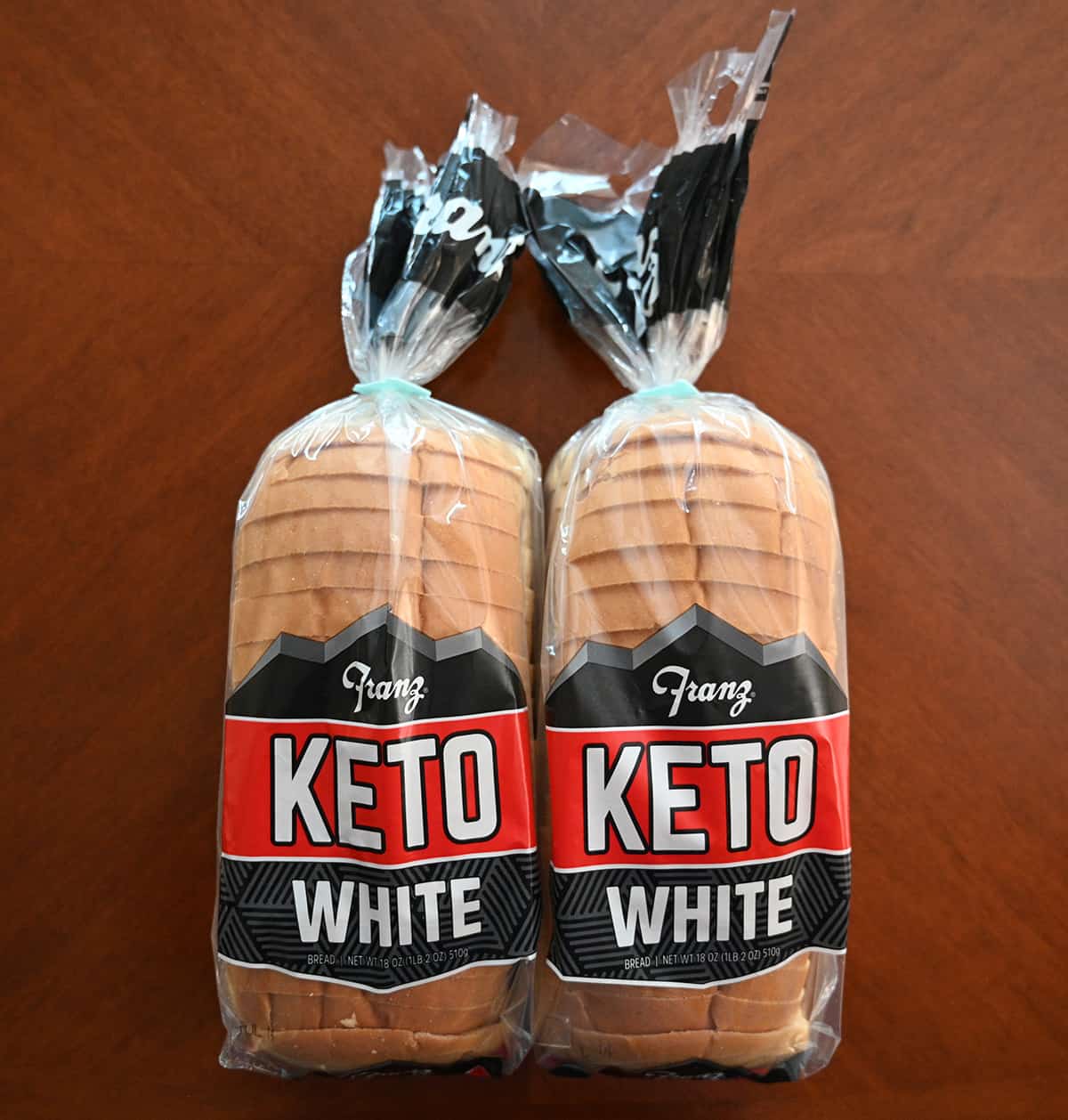 Top down image showing two full loaves of Franz Keto Bread from Costco sitting on a table.