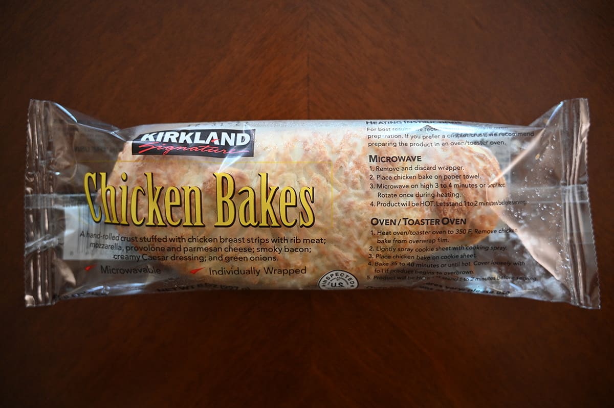 Top down image of one chicken bake individually wrapped, sitting on a table.