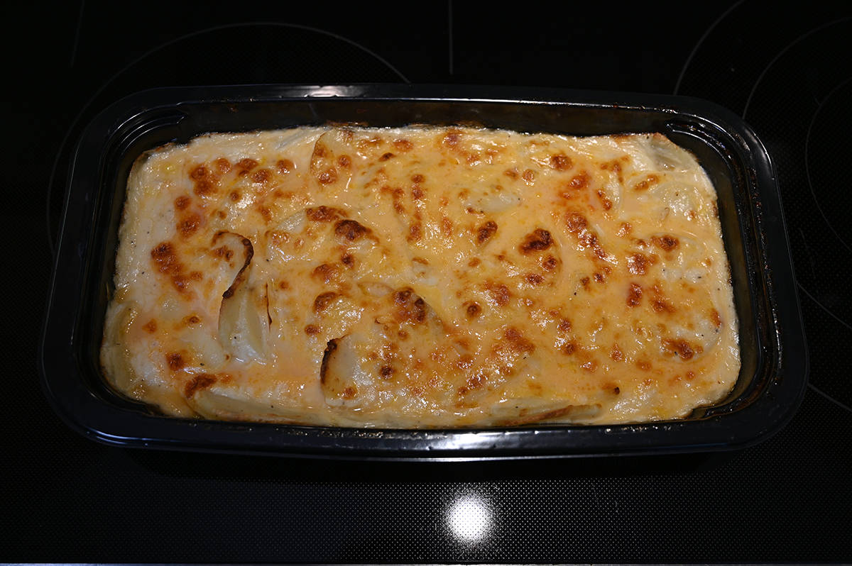 Top down image of a tray of baked scalloped potatoes.