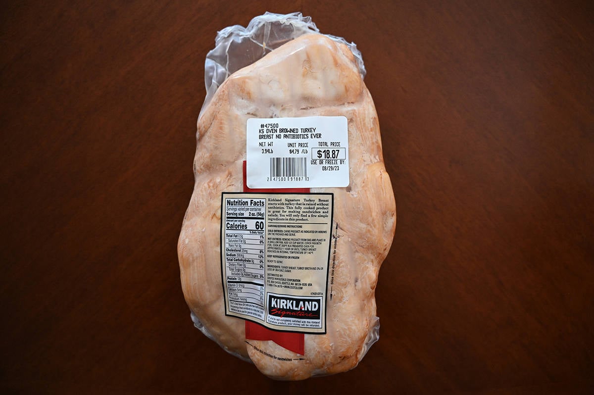 Top down image of the back side of the turkey breast in the packaging showing the cost and product description.