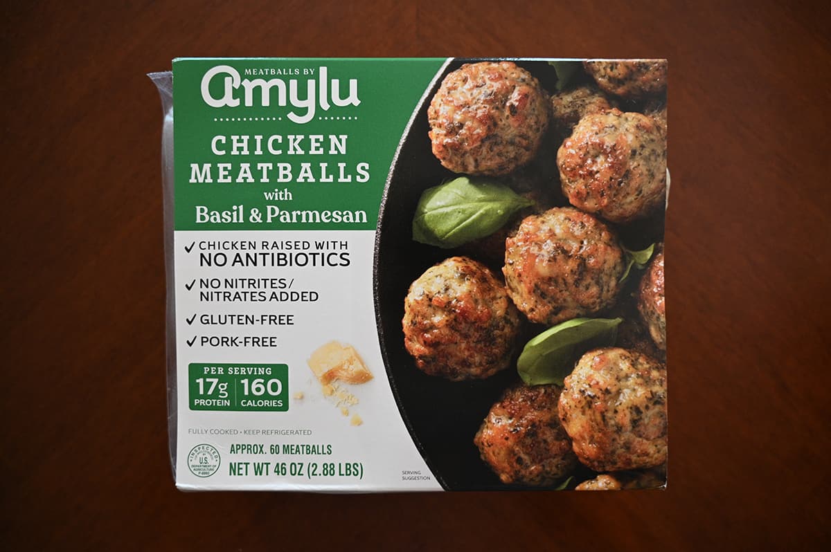 Image of the Costco Amylu Chicken Meatballs with Basil & Parmesan package sitting on a table unopened.