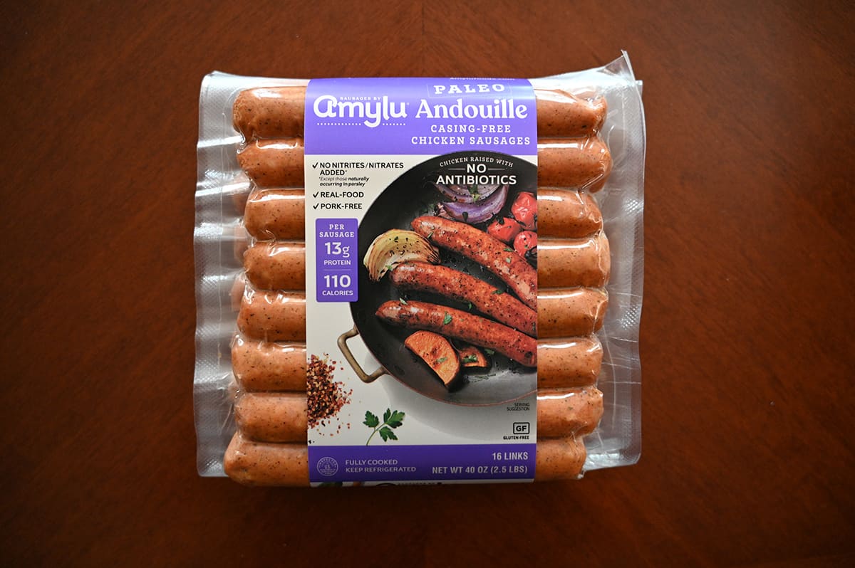 Top down image of the Amylu Andouille Sausages package unopened and sitting on a table.