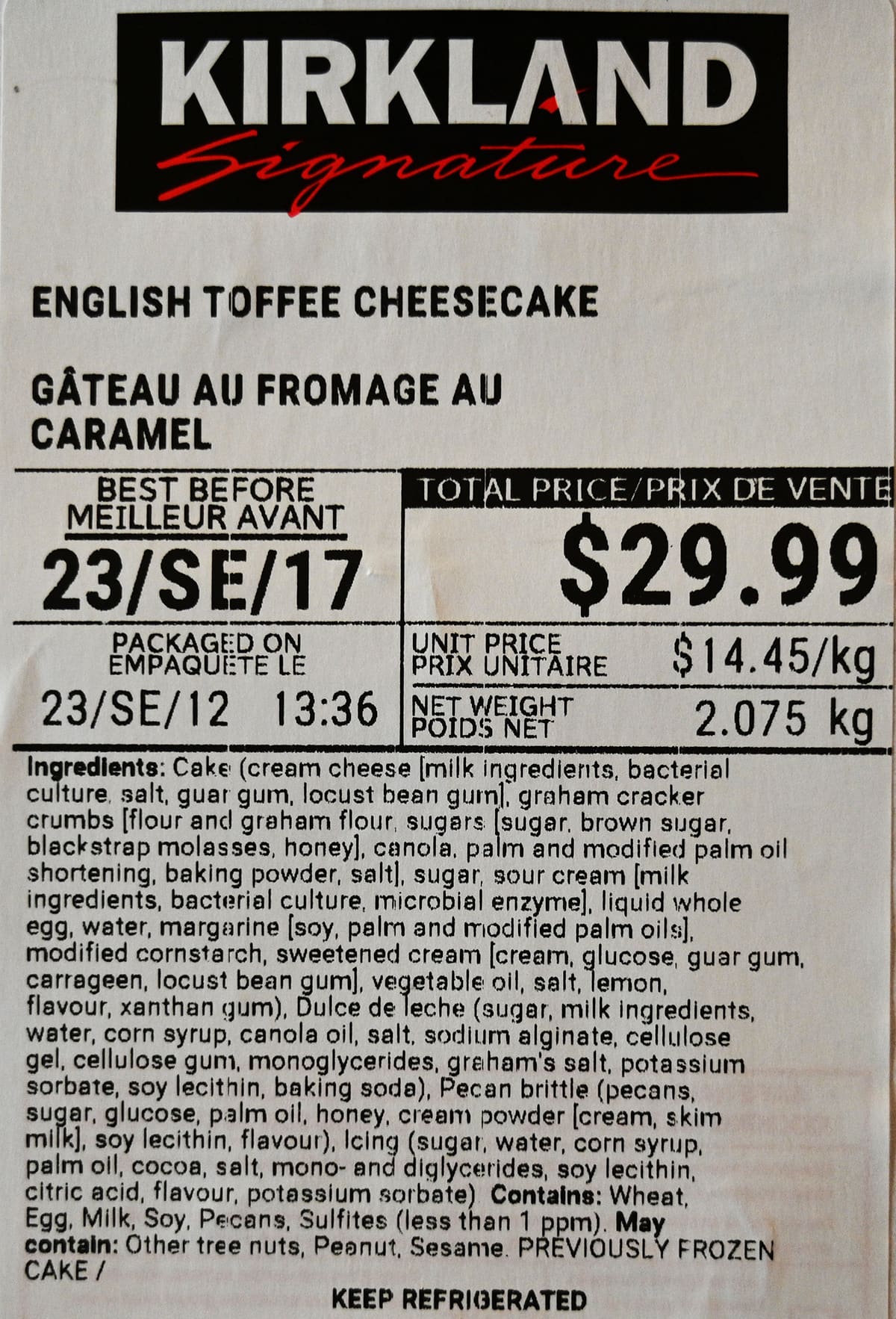 Closeup image of the front label on the cheesecake showing the best before date and cost as well as ingredients,
