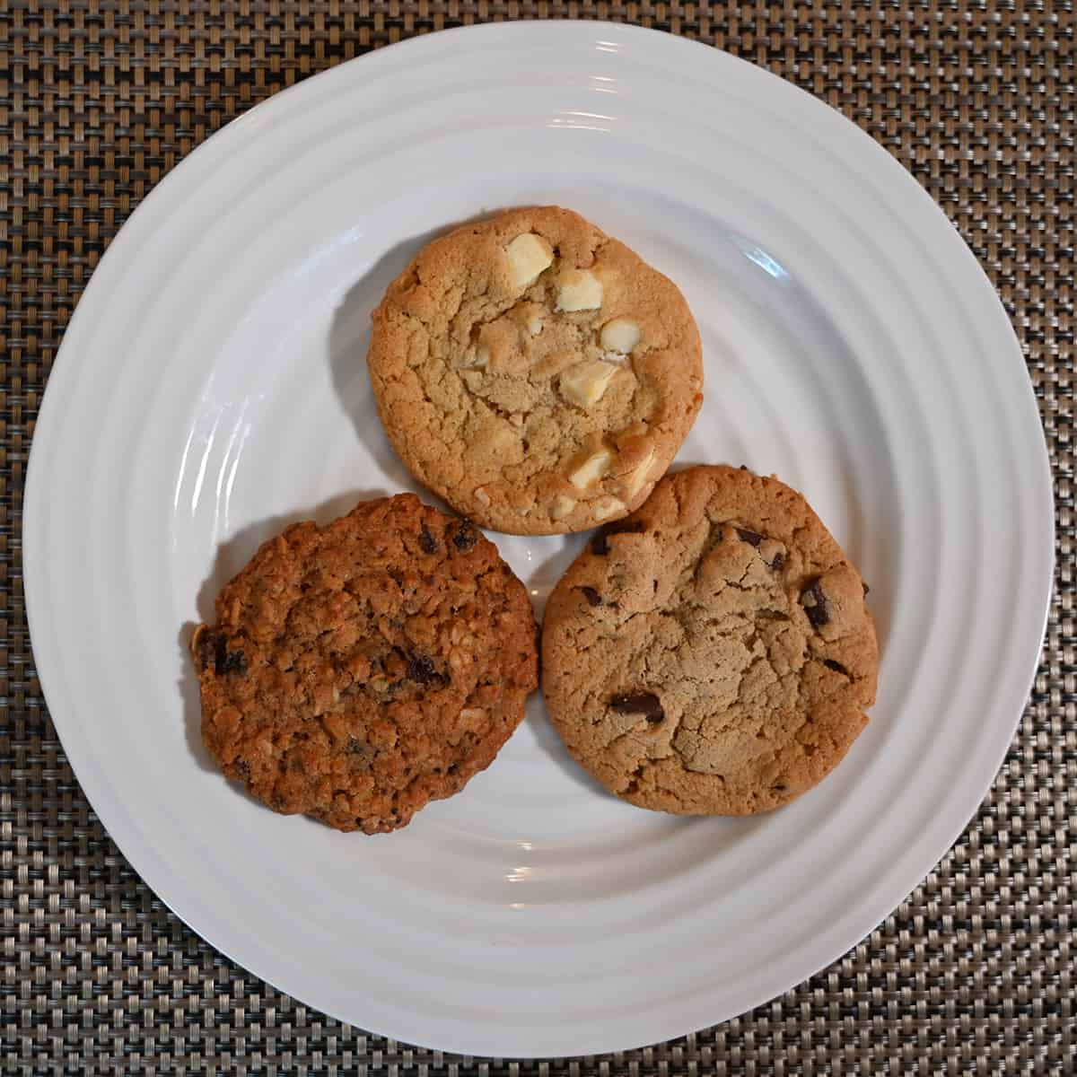 Top down image of all three kinds of cookies from the pack served on a white plate.