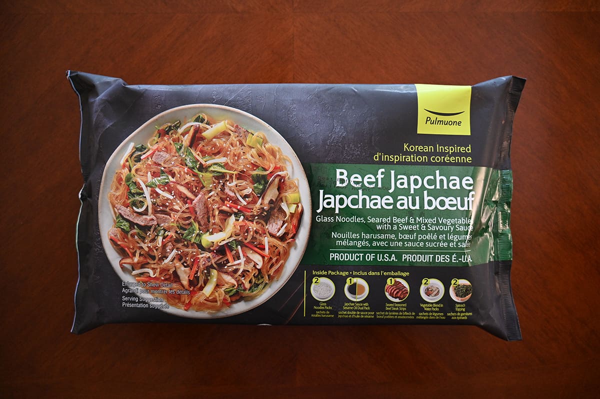 Image of the Costco Pulmuone Beef Japchae meal unopened sitting on a table.