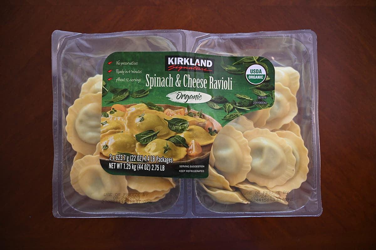 Top down image of the Costco Kirkland Signature Organic Spinach & Cheese Ravioli package sitting on a table.