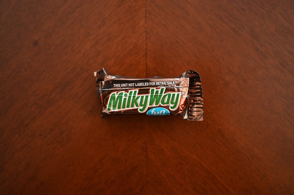 Top down image of an unopened Milky Way chocolate bar sitting on a table.