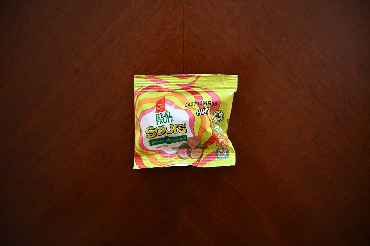 Top down image of a bag of Real Fruit Sours bag unopened sitting on a table.