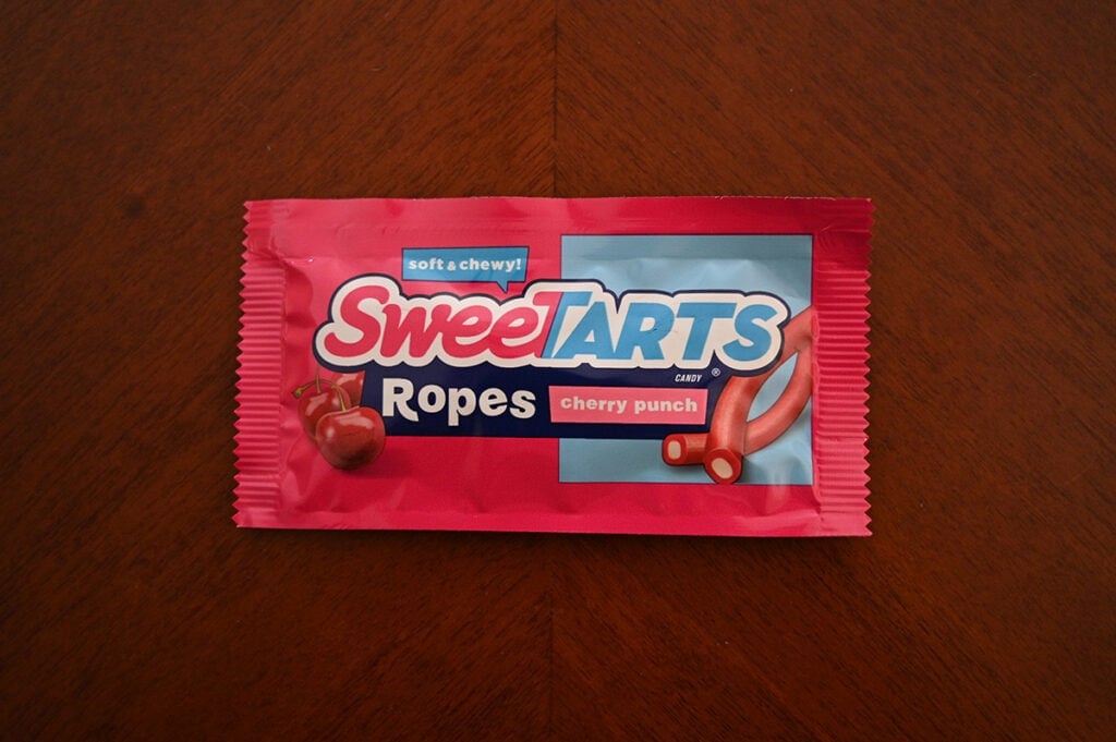 Top down image of Sweetarts candy unopened sitting on a table.