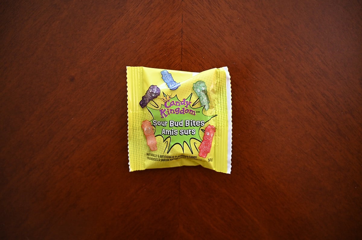 Top down image of a bag of Candy Kingdown Sour Bud Bites sitting on a table.