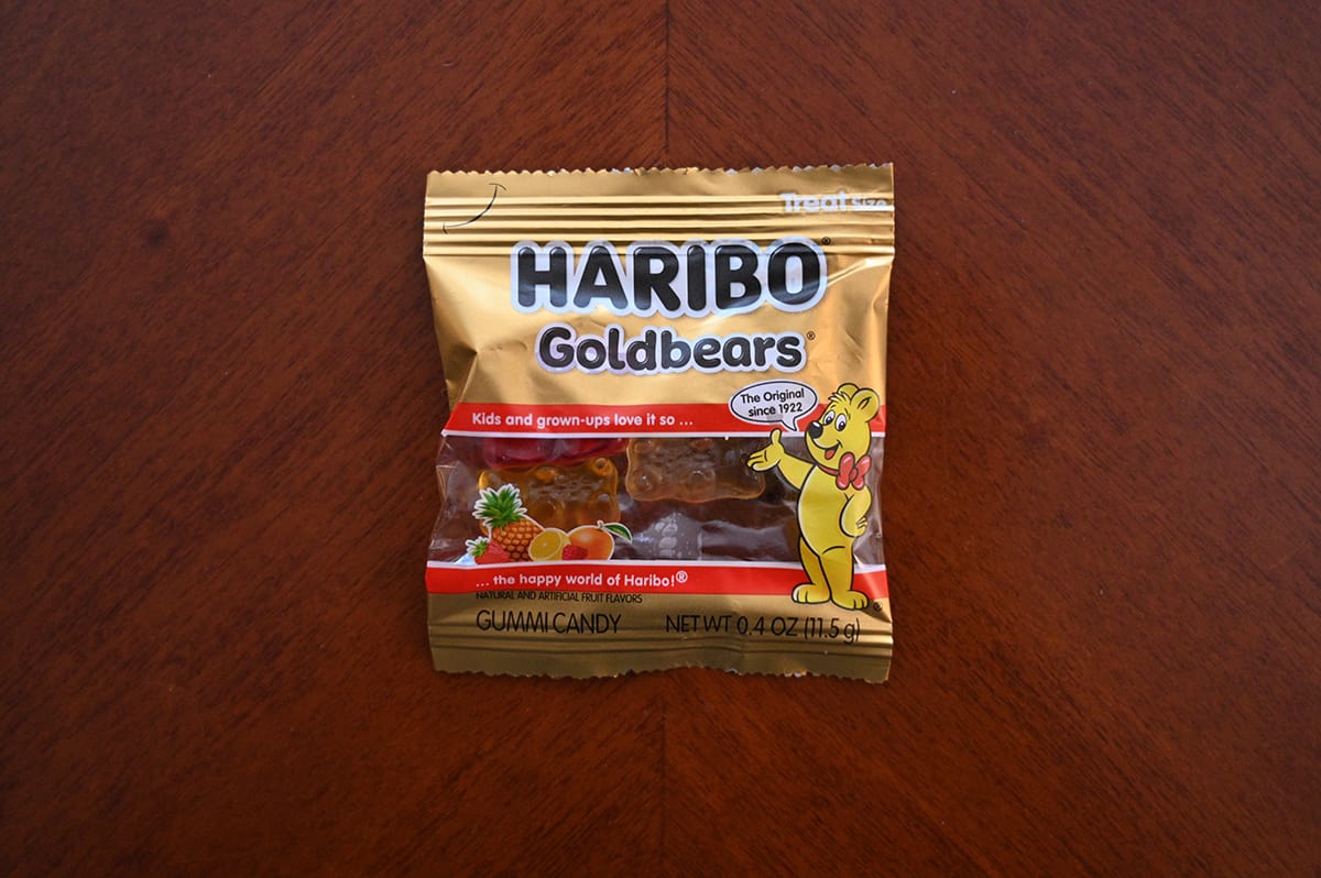 Top down image of Harribo Goldbears Gummy Bears candy sitting on a table unopened.