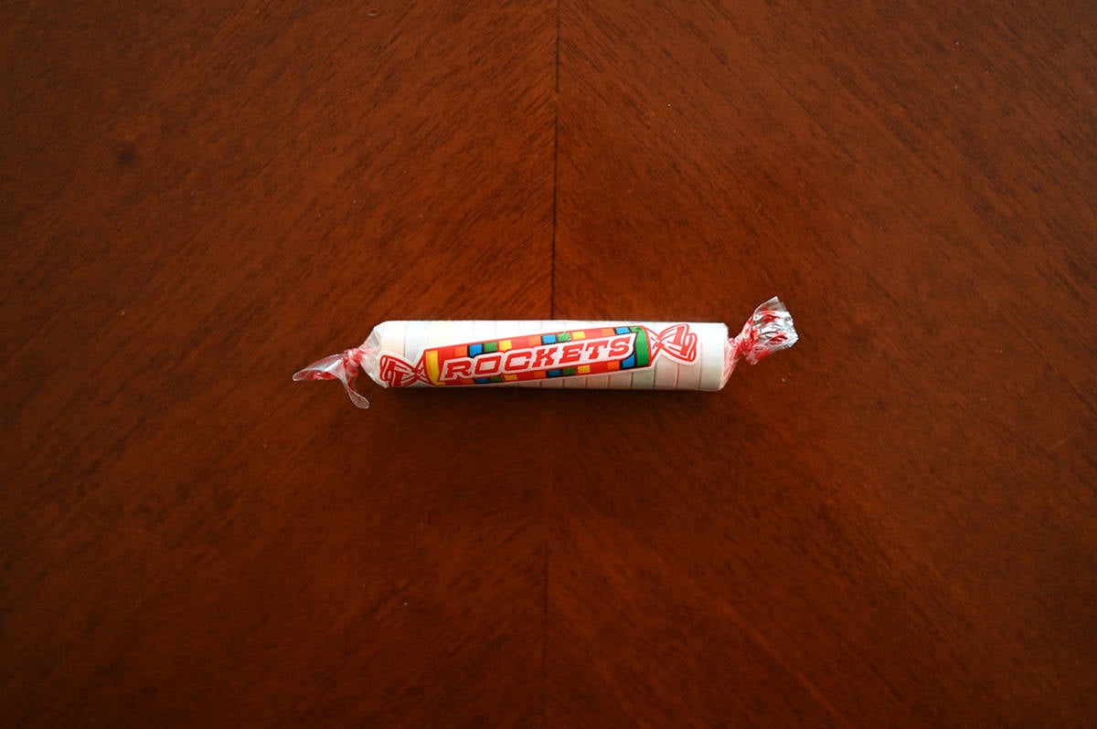 Top down image of an unopened packet of rockets on a table.