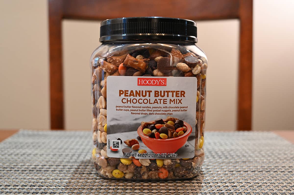 Image of the Costco Hoody's Peanut Butter Chocolate Mix container sitting on a table.