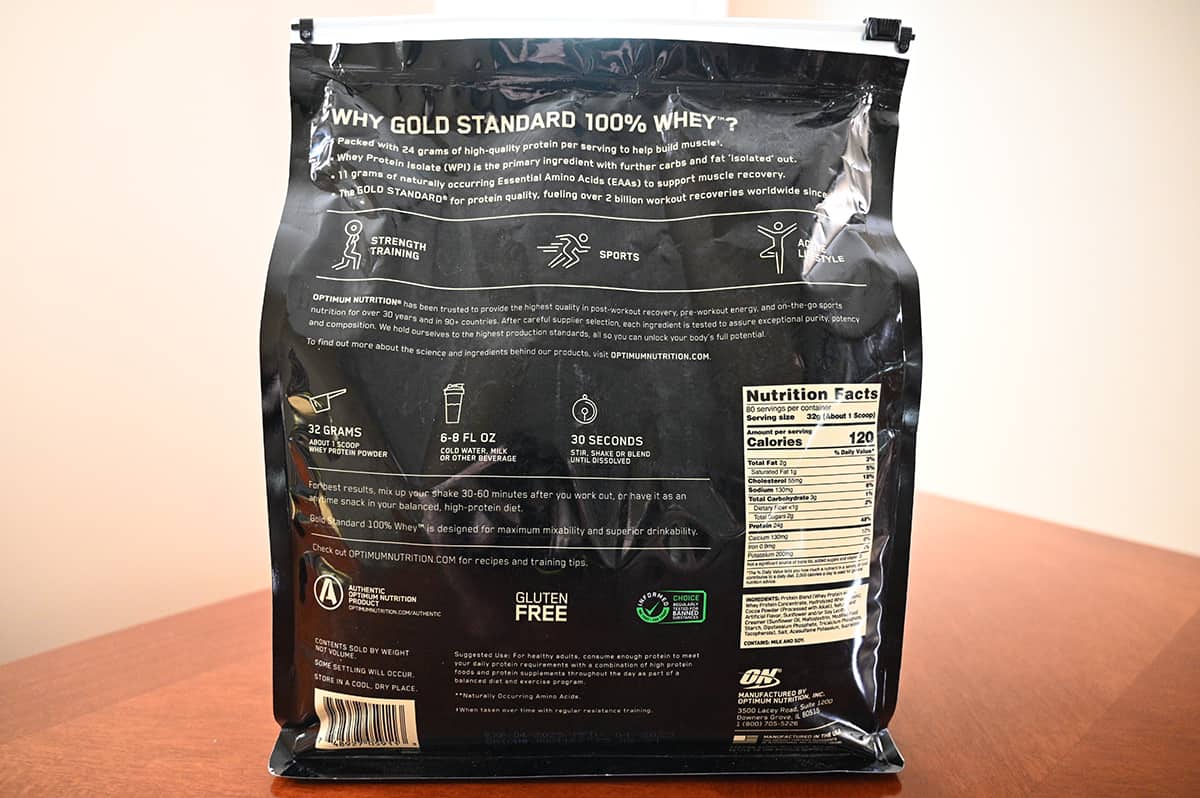 Image of the back of the bag of chocolate protein powder showing nutrition facts, product description.