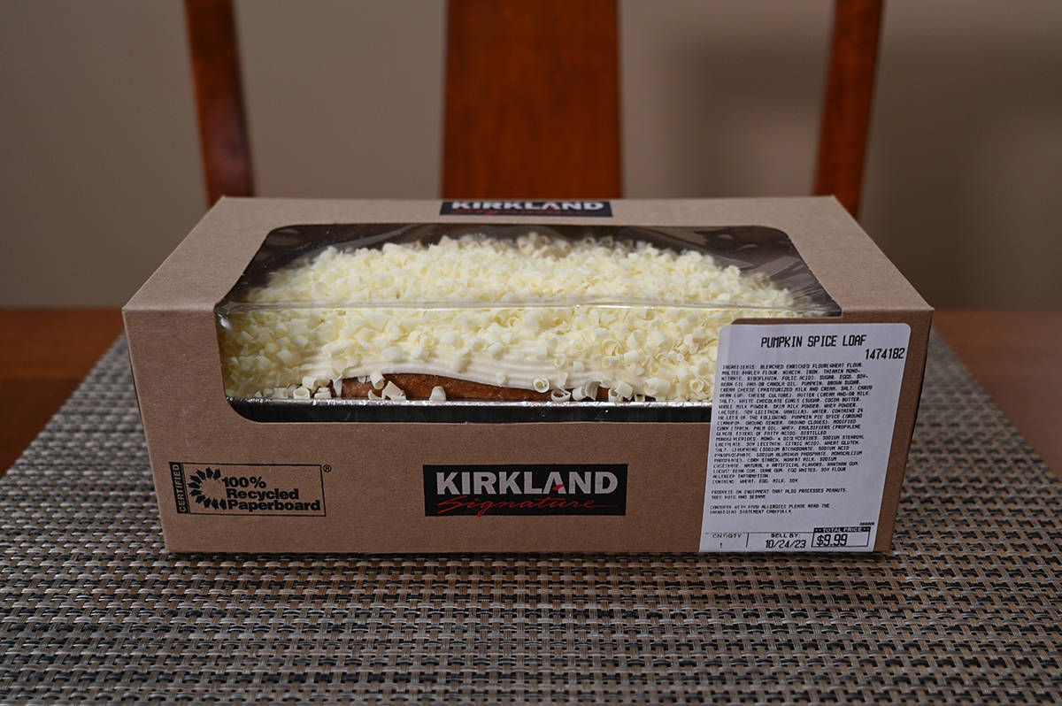Side view image of a packaged, unopened Costco Kirkland Signature Pumpkin Spice Loaf sitting on a table.
