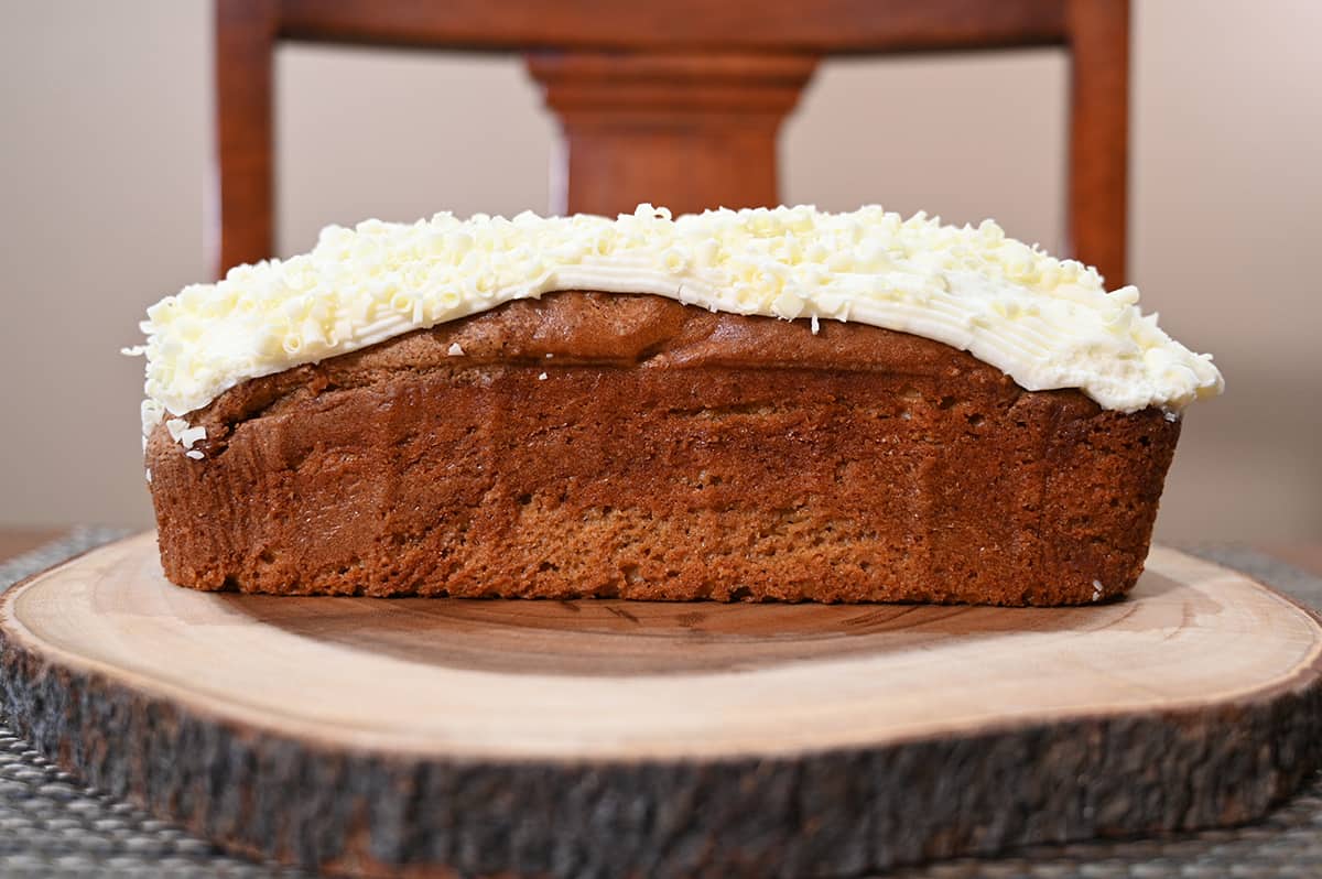 Closeup sideview image of the pumpkin spice loaf showing the thickness of the layer of icing on top.