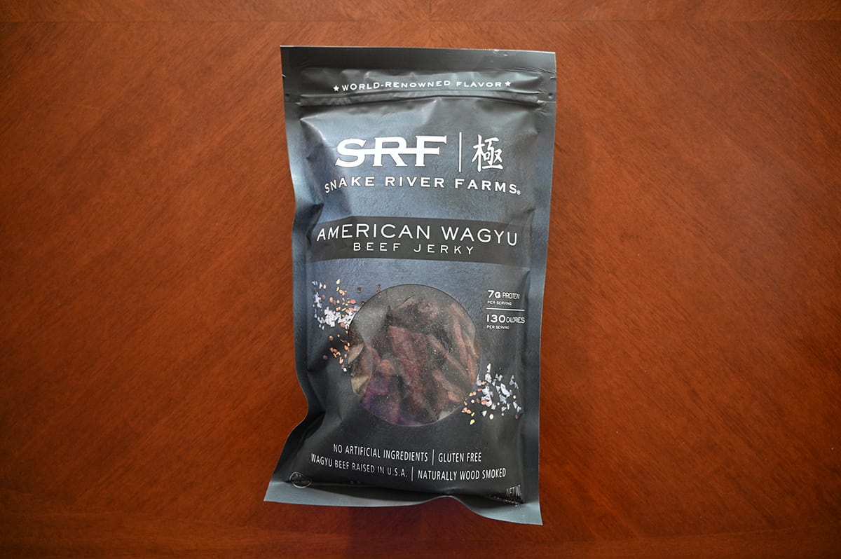 Image of the Costco Snake River Farms American Wagyu Beef Jerky bag sitting on a table unopened.