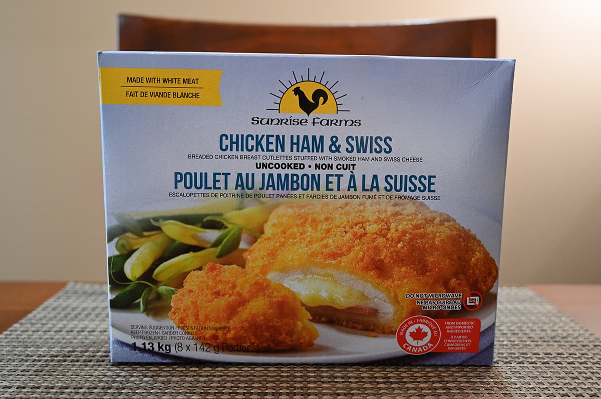 Image of the Costco Farms Chicken Ham & Swiss Breaded Chicken Breast box unopened sitting on a table.