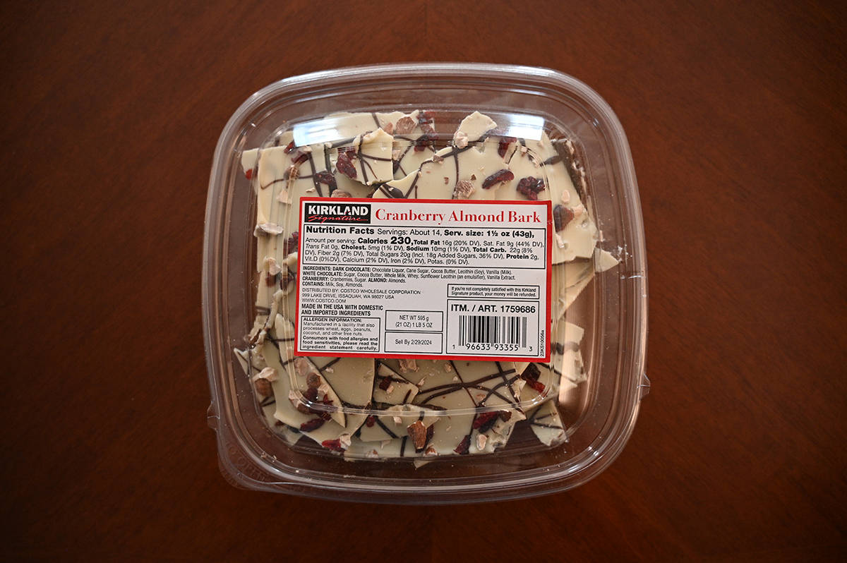 Top down image of an unopened Costco Kirkland Signature Cranberry Almond Bark sitting on a table.