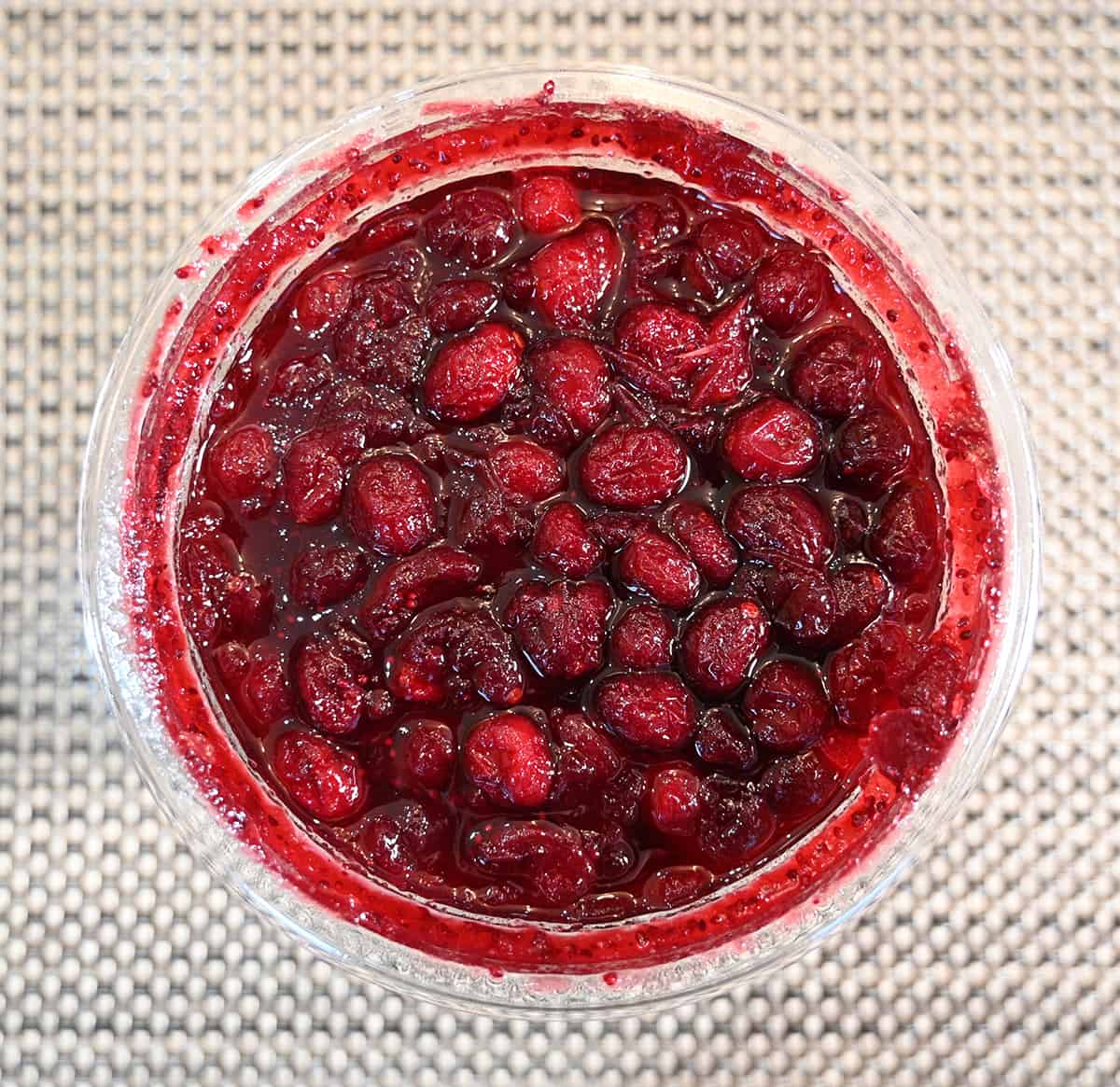 Top down image of an opened cranberry sauce container showing what the cranberry sauce looks like.