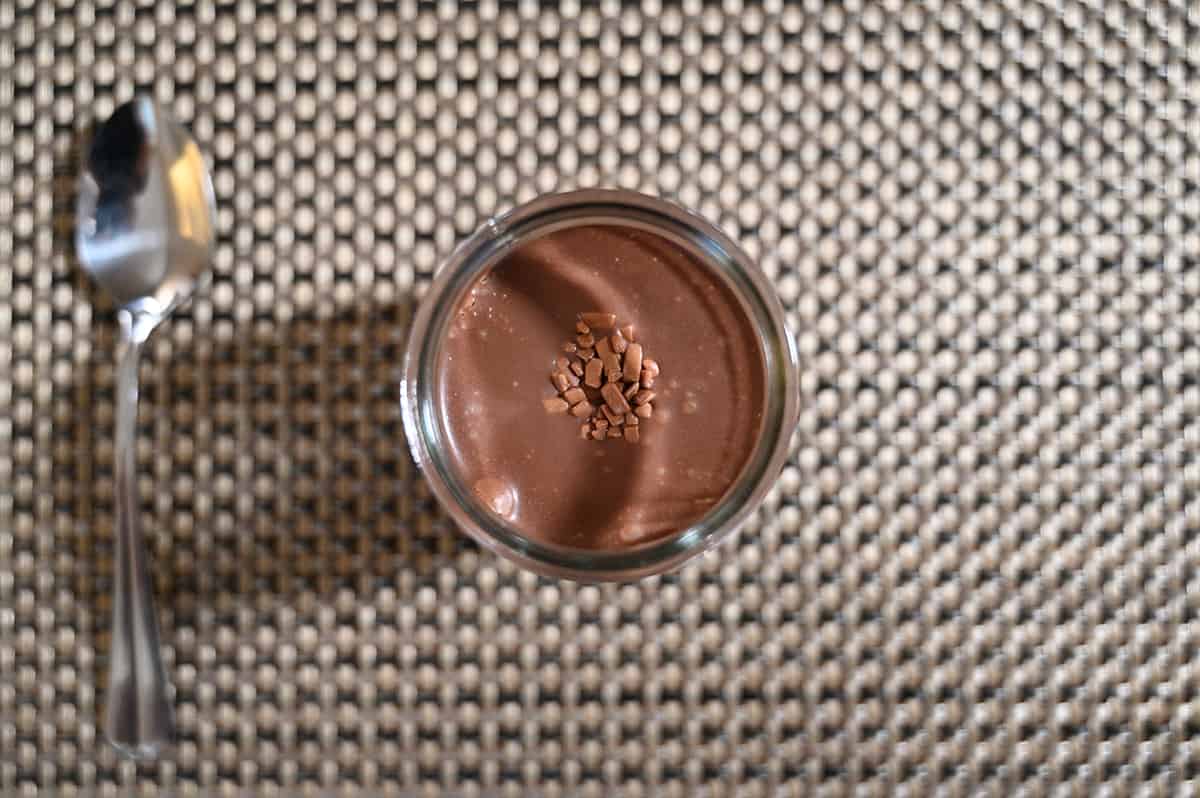 Top down image of the top of an opened mousse cup showing the dark chocolate ganache on top.