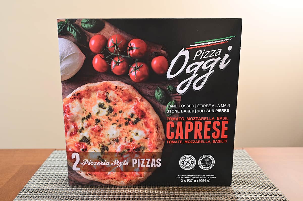 Image of the Costco Pizza Oggi box unopened sitting on a top.