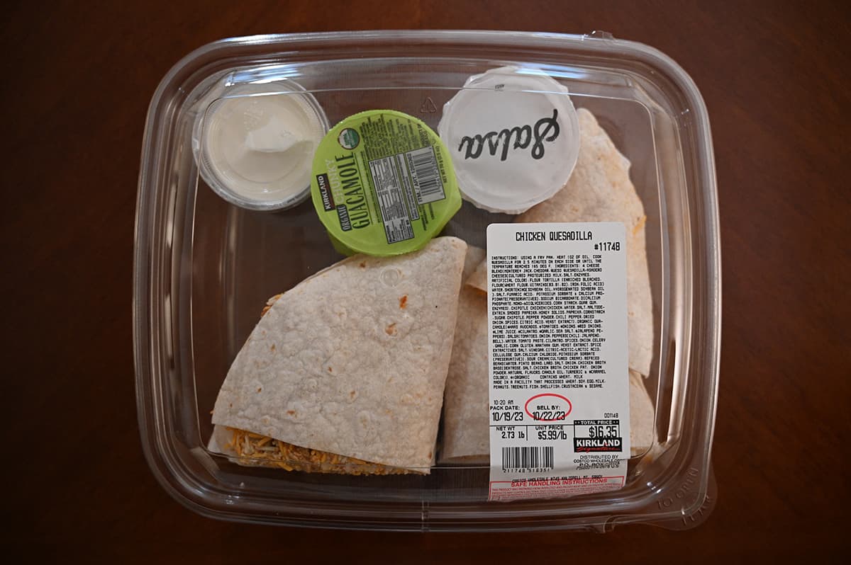 Top down image of the Costco Kirkland Signature Chicken Quesadillas container unopened sitting on a table.