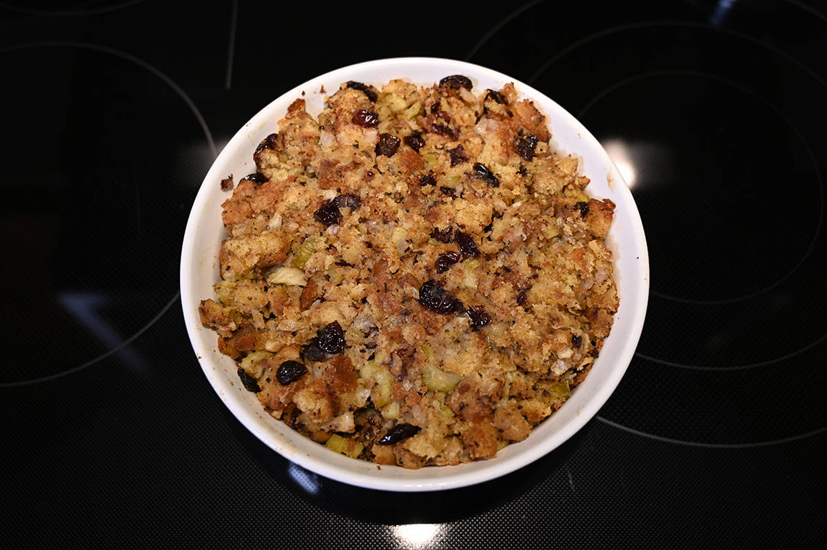 Top down image of a casserole dish full of cooked stuffing.