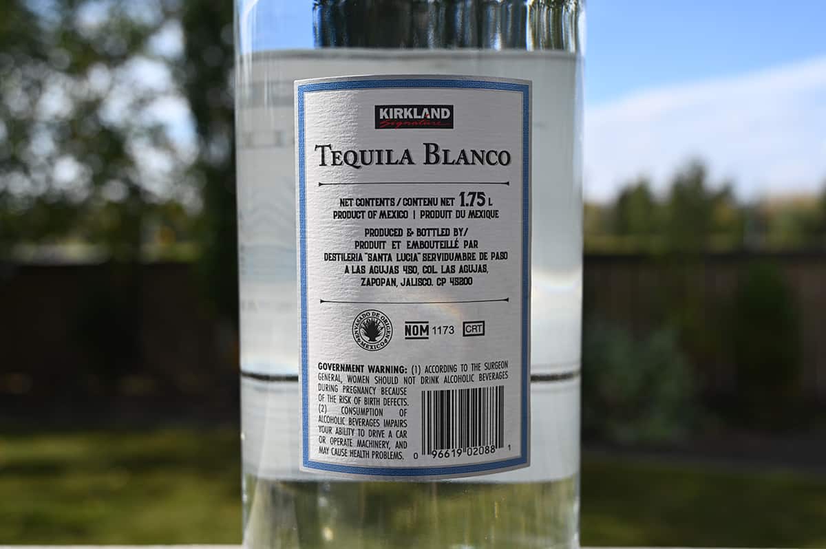 Closeup image of the back label on the anejo tequila showing product of mexico and produced by.