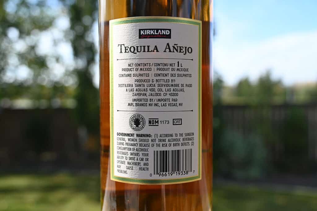 Closeup image of the back label on the anejo tequila showing product of mexico, contains sulphites.