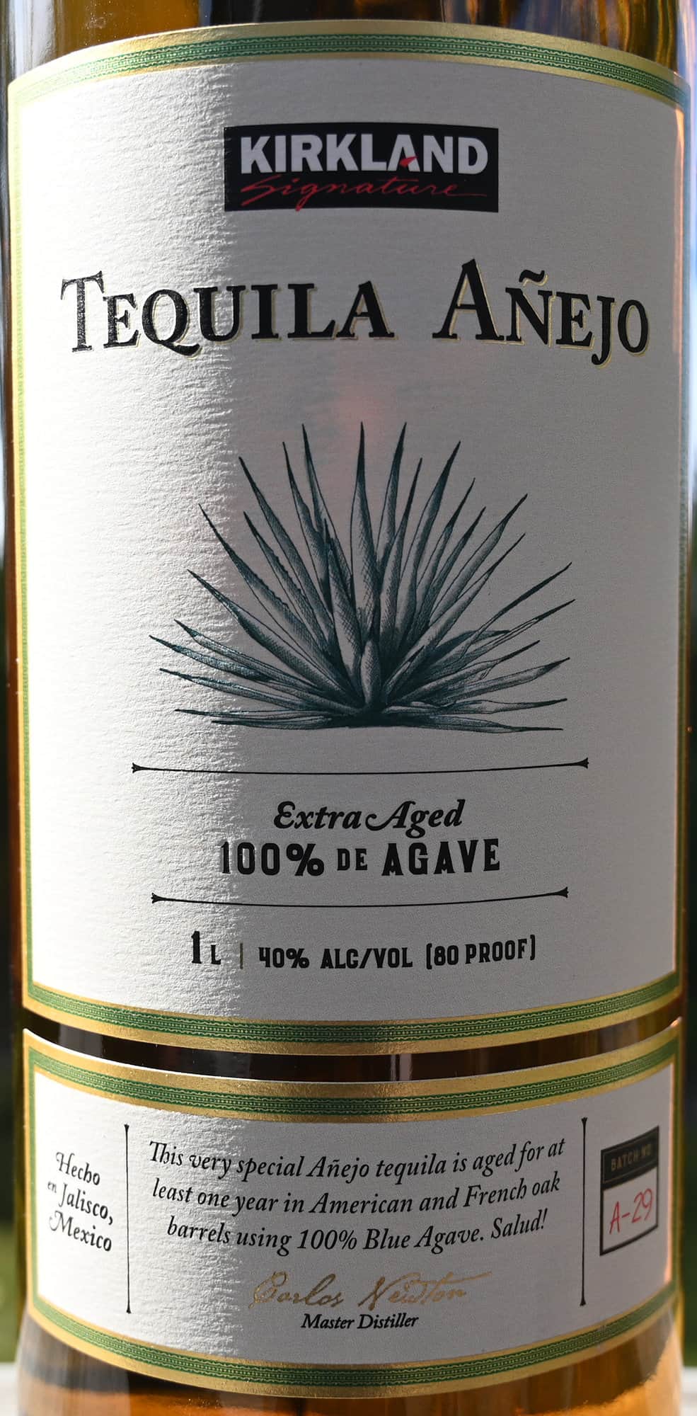 Closeup image of the front label on the anejo tequila showing alcohol percentage and product description.