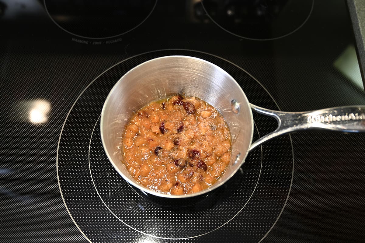 Top down image of the chutney heating in a pot.