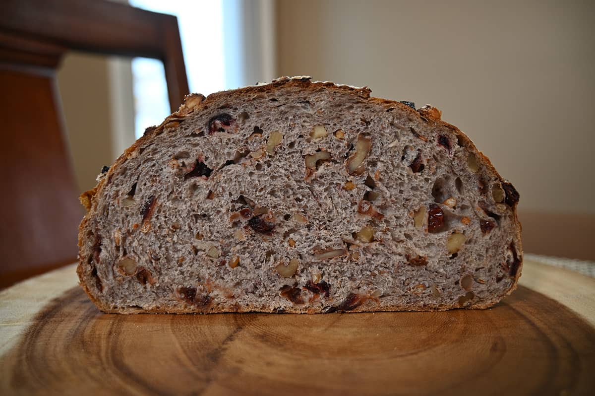 Side view image of the Kirkland Signature Cranberry Walnut loaf cut in half so you can see the center of the loaf.