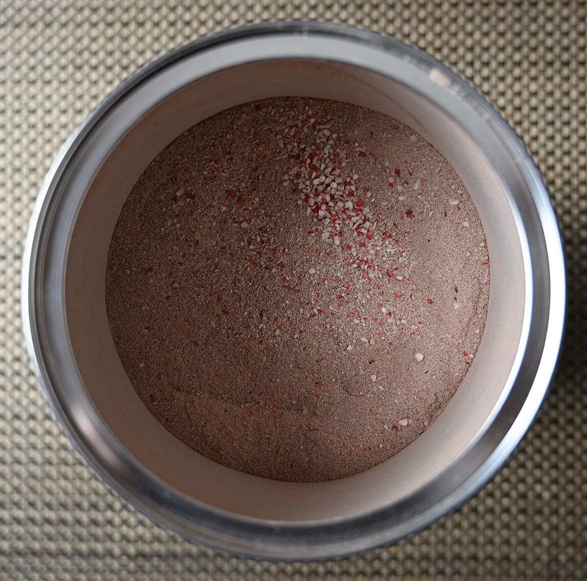 Top down closeup image of the candycane mix container opened so you can see the powder.