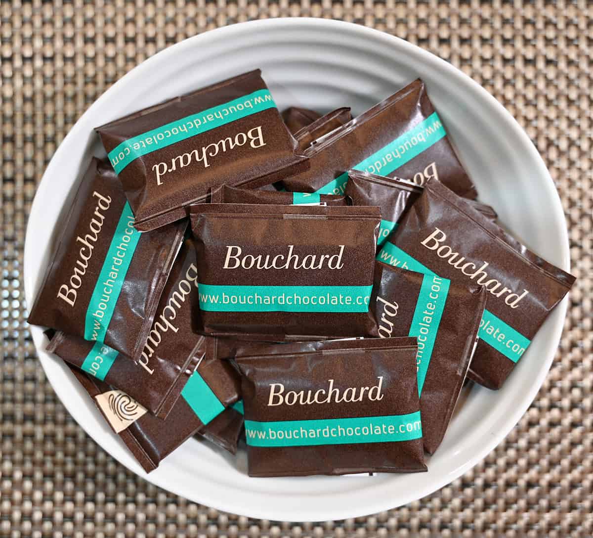 Top down image of a bowl of individually wrapped mint chocolates.