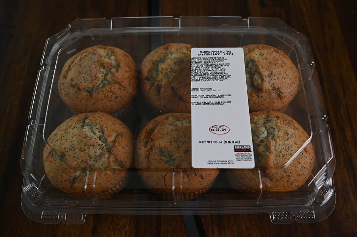 Top down image of the six pack of Almond Poppy Muffins with the lid closed.