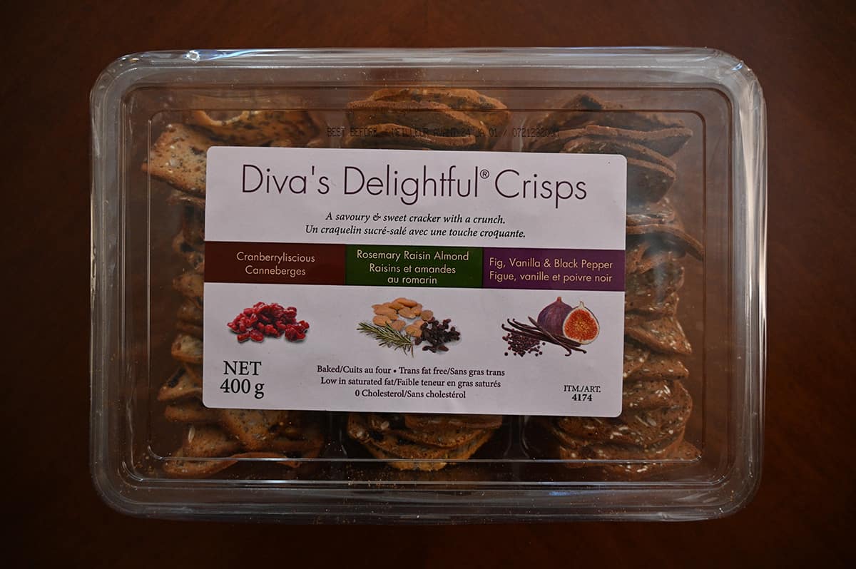 Image of the Costco Diva's Delightful Crisps container sitting on a table unopened.