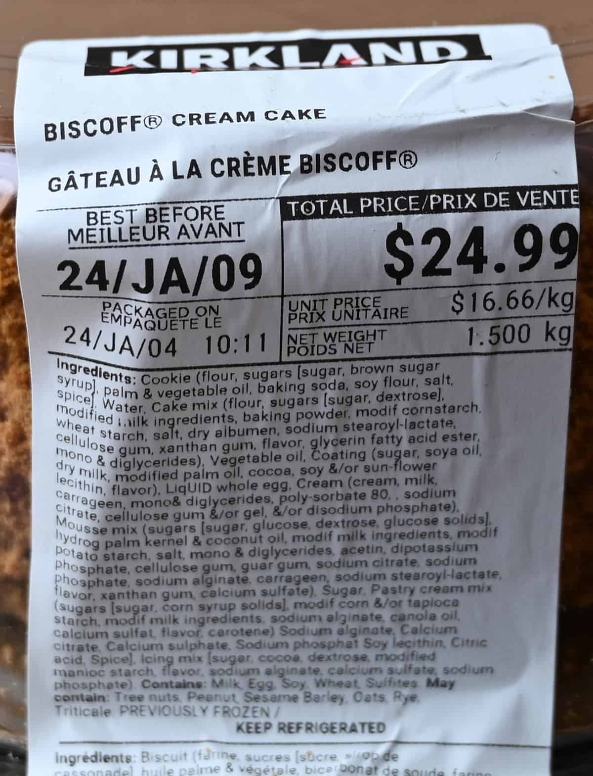 Closeup image of the front label on the cake showing best before date, ingredients and cost.