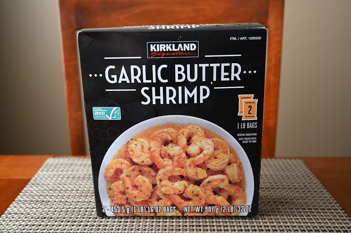 Image of the Costco Kirkland Signature Garlic Butter Shrimp box sitting on a table unopened.