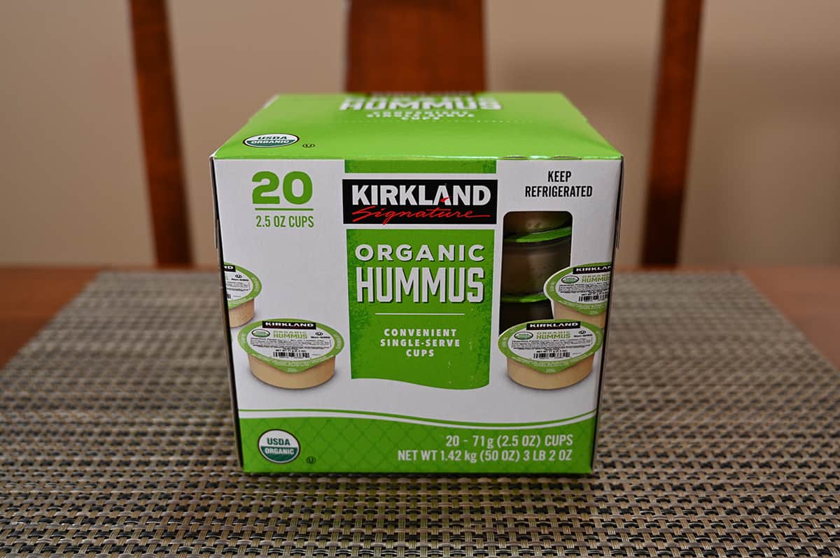 Image of the Costco Kirkland Signature Organic Hummus box unopened sitting on a table.