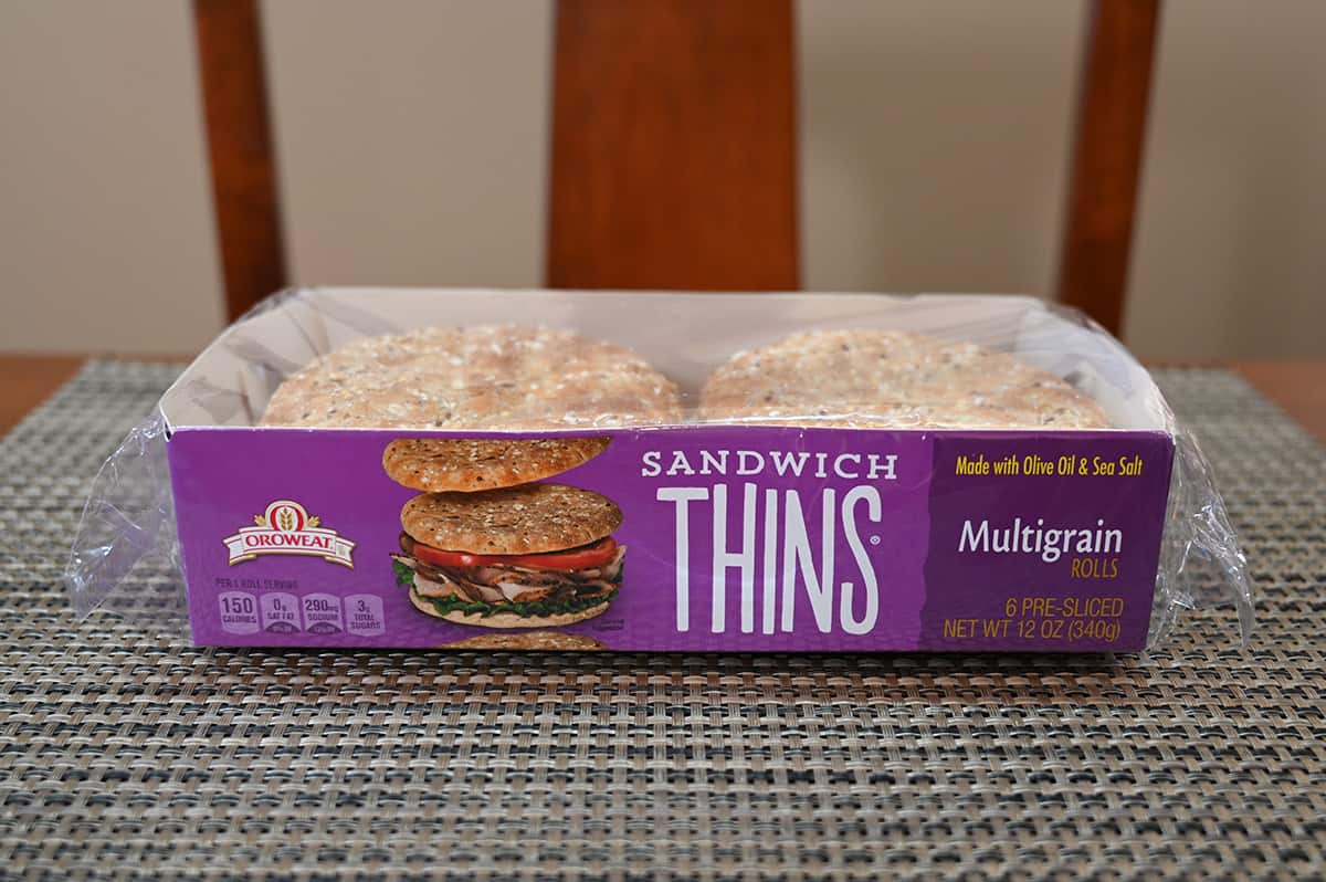 Image of the Costco Orowheat Sandwich Thins unopened in their package sitting on a table.