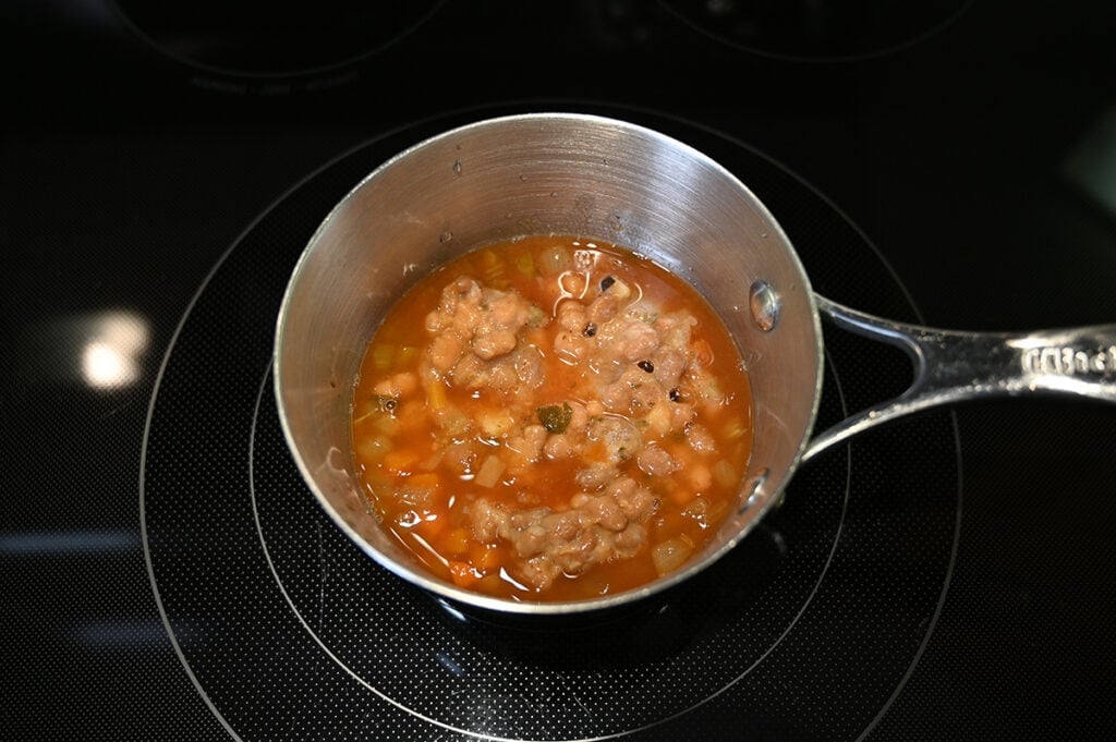 Top down image of the soup being heated in a saucepan.