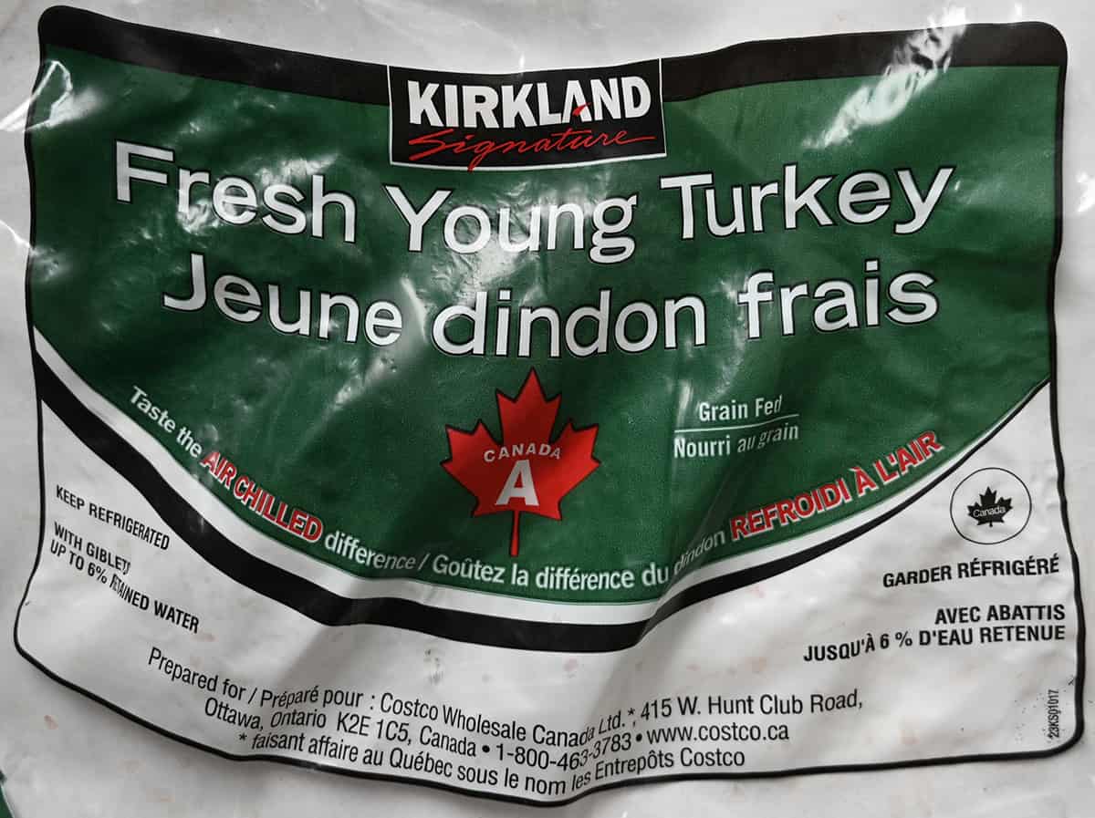 Closeup image of the front label on thr turkey showing the name and that it needs to be kept refrigerated and is air chilled.