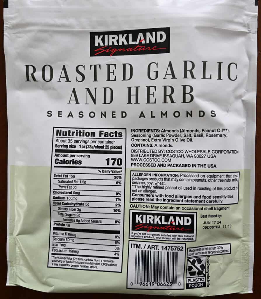 Closeup image of the back of the bag of almonds showing ingredients, nutrition facts, and where the almonds are packaged.