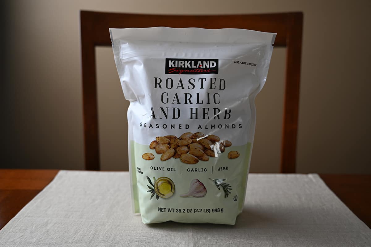 Image of the Costco Kirkland Signature Roasted Garlic and Herb Almonds unopened sitting on a table.