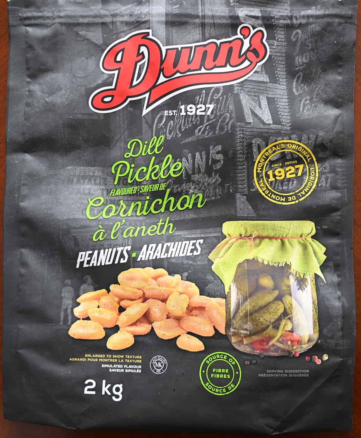 Closeup image of the front of the bag of peanuts showing that the flavor is simulated and the bag weighs two kilograms. 