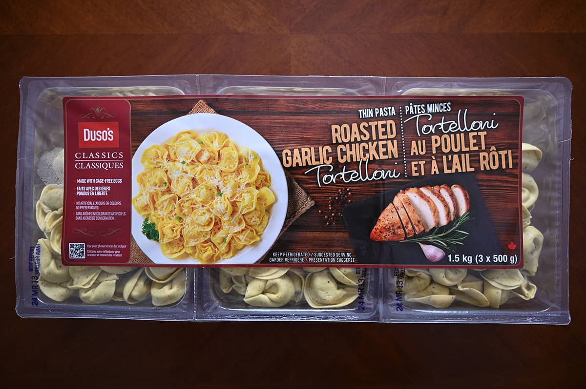 Image of the Costco Duso's Roasted Garlic Chicken Tortelloni three pack sitting on a table.